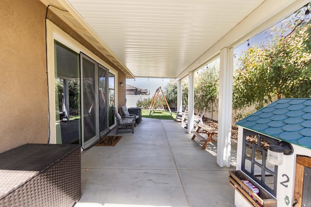 view of patio featuring fence