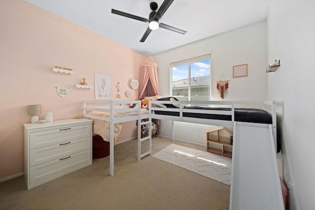 bedroom with light carpet and ceiling fan