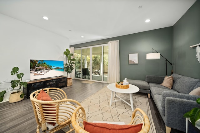 living area with recessed lighting and wood finished floors