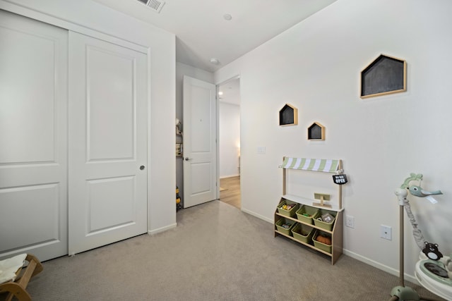 playroom featuring carpet, visible vents, and baseboards