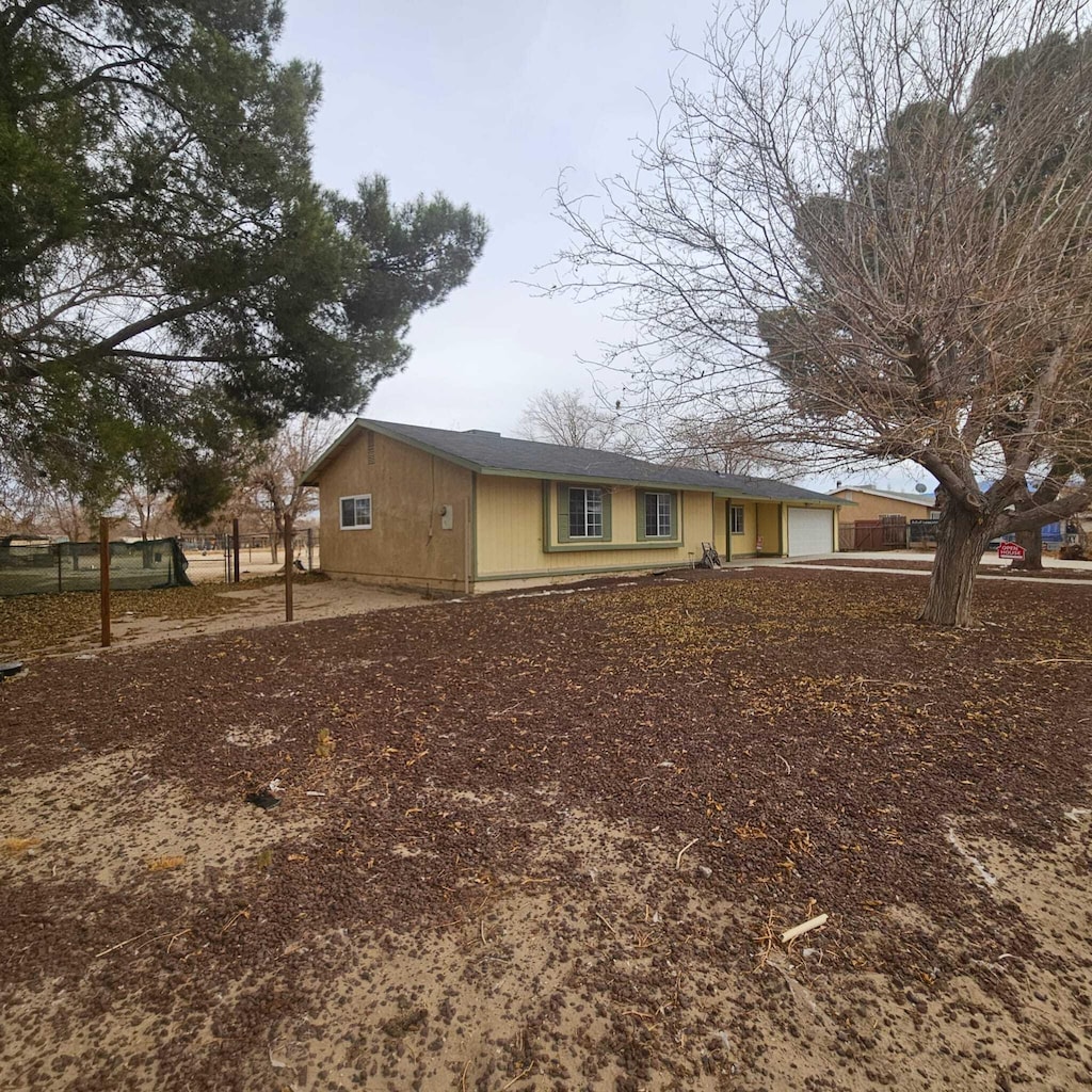 view of side of property with a garage