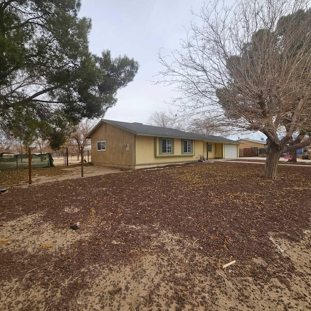 view of side of property with a garage