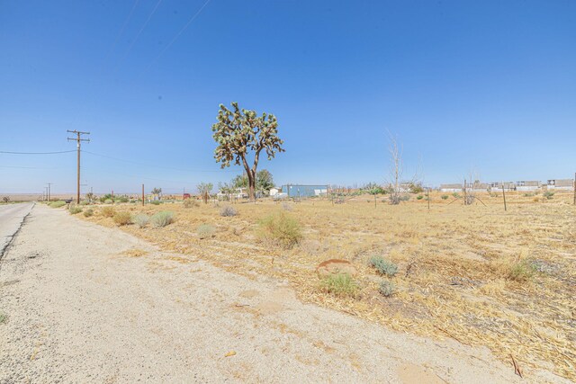 15035 E E Ave Unit G, Lancaster, CA 93535 - view of asphalt road with a view of countryside