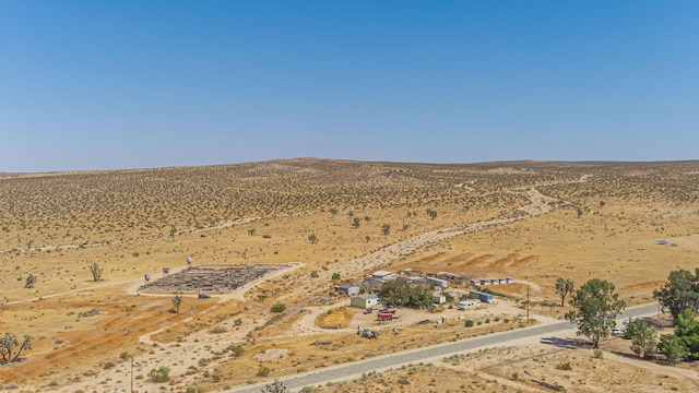 15035 E E Ave Unit G, Lancaster, CA 93535 - aerial view of sparsely populated area with a desert landscape and a mountain backdrop