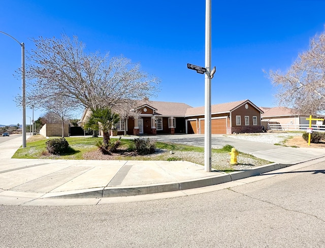 view of front facade featuring driveway and an attached garage