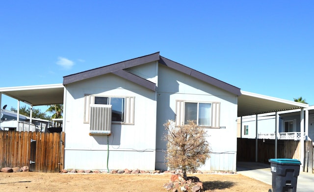 view of side of property with a carport