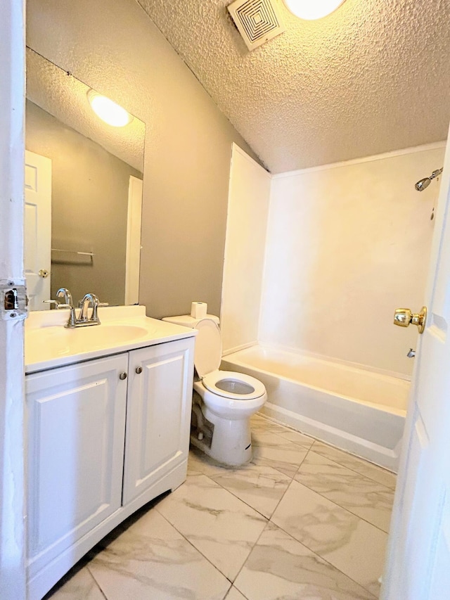 full bathroom with vanity, toilet, a textured ceiling, and bathtub / shower combination