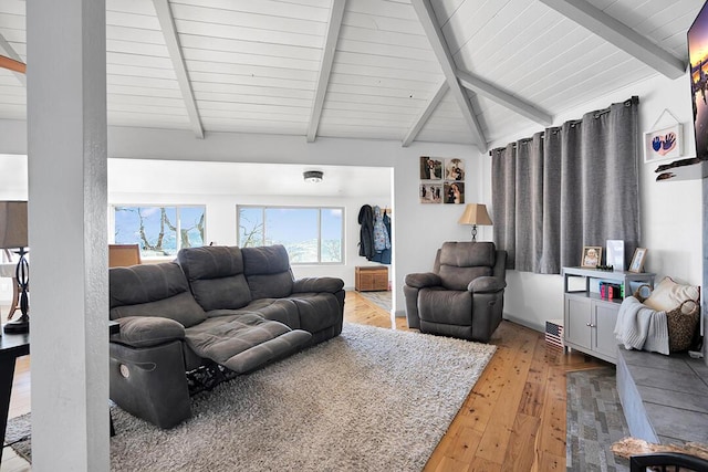 living room featuring hardwood / wood-style flooring, wooden ceiling, and beam ceiling