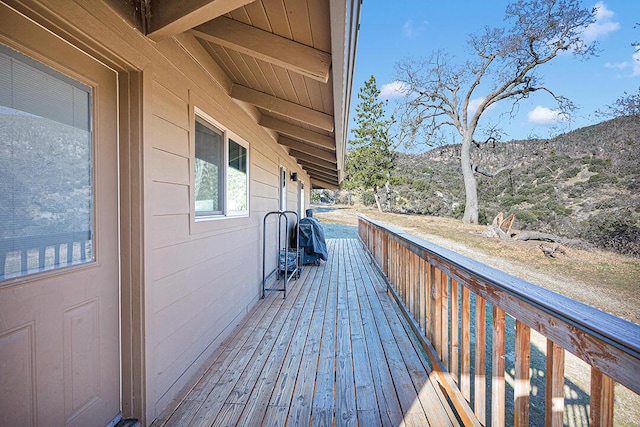 wooden terrace with a mountain view