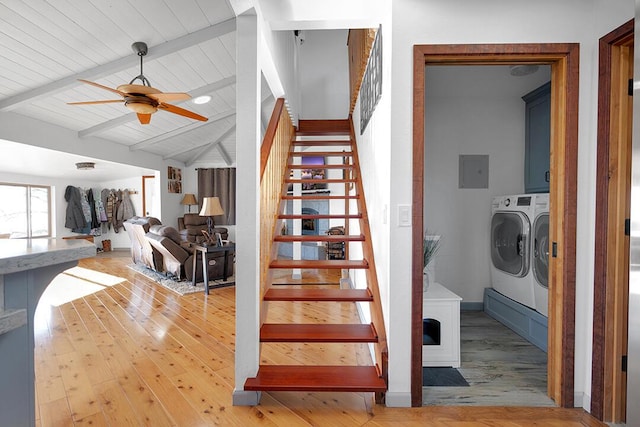 stairs featuring vaulted ceiling with beams, hardwood / wood-style floors, wood ceiling, and independent washer and dryer