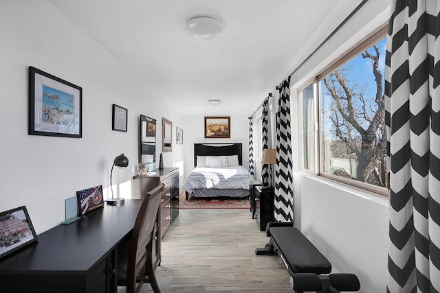 bedroom with light hardwood / wood-style flooring