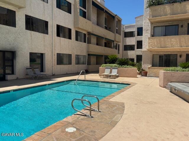 5310 Zelzah Ave Unit 305, Encino, CA 91316 - community pool featuring a patio