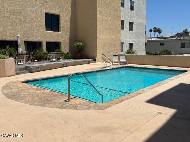 5310 Zelzah Ave Unit 305, Encino, CA 91316 - community pool featuring a patio