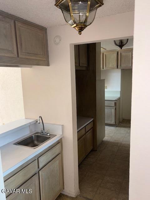 5310 Zelzah Ave Unit 305, Encino, CA 91316 - kitchen with a textured ceiling, light countertops, and light flooring