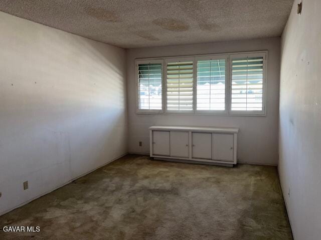 5310 Zelzah Ave Unit 305, Encino, CA 91316 - carpeted spare room with healthy amount of natural light and a textured ceiling