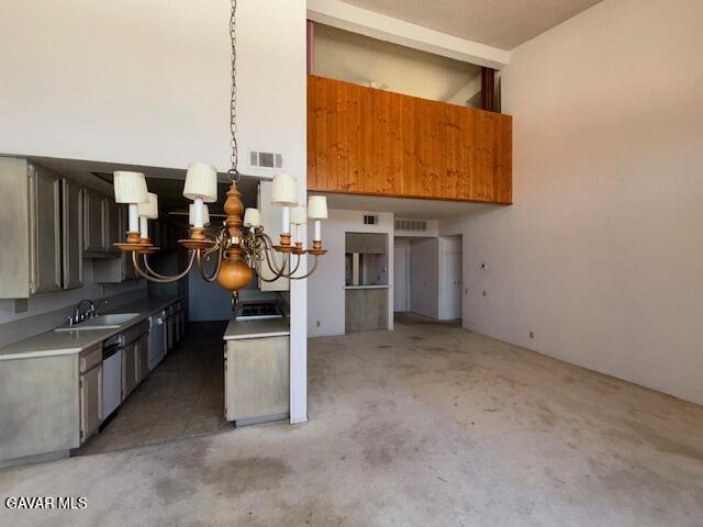 5310 Zelzah Ave Unit 305, Encino, CA 91316 - kitchen with a chandelier, dishwasher, and light countertops
