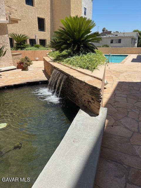 5310 Zelzah Ave Unit 305, Encino, CA 91316 - view of pool with a patio