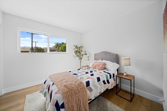 bedroom featuring wood-type flooring