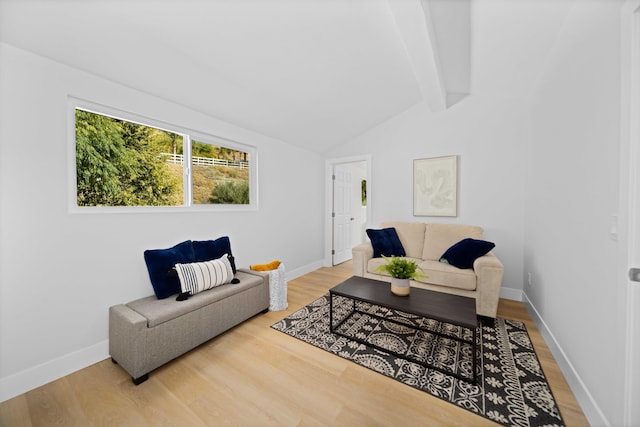 living room with wood-type flooring and lofted ceiling with beams