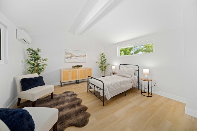 bedroom with vaulted ceiling with beams, light wood-type flooring, and a wall mounted AC