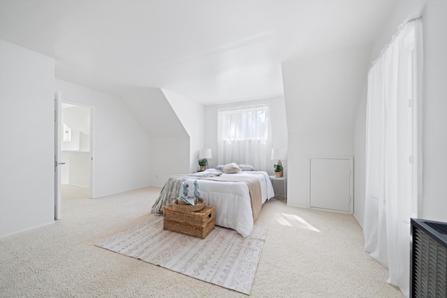 bedroom featuring light carpet