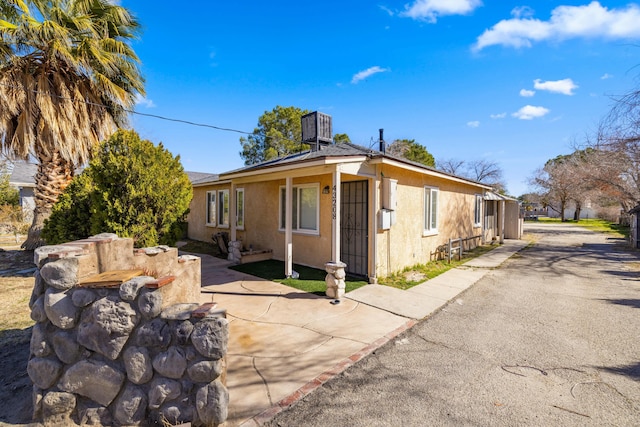 view of property exterior featuring central AC unit and stucco siding