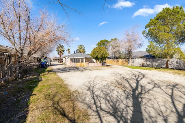 view of front of house featuring fence and driveway