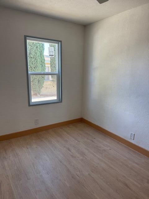 43427 Fairglen Rd, Lancaster, CA 93535 - empty room featuring light wood-type flooring and baseboards