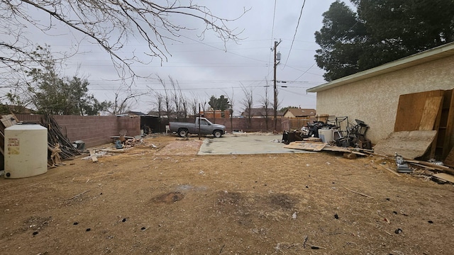 view of yard with a fenced backyard and a patio