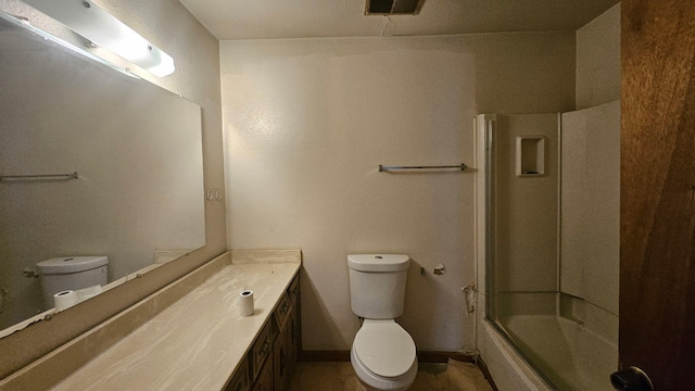 full bathroom with baseboards, visible vents, toilet, shower / bath combination with glass door, and vanity