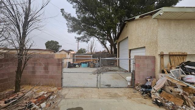 view of gate with fence