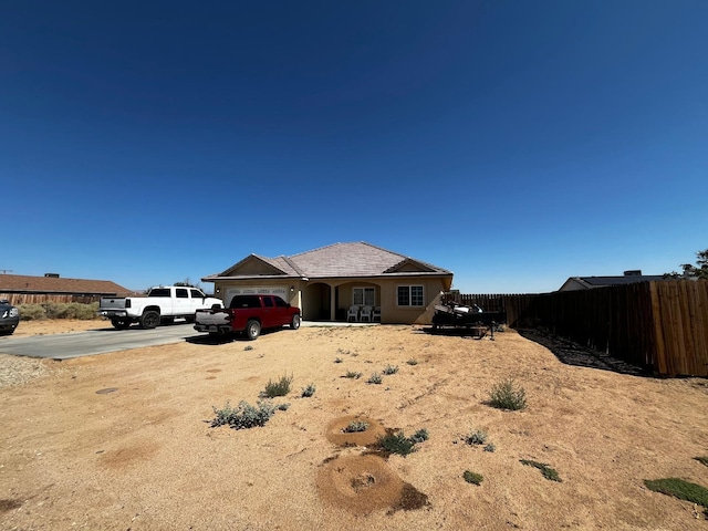 ranch-style home featuring a garage