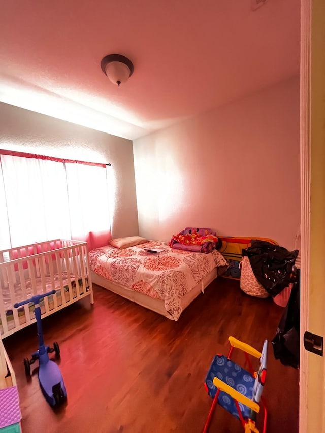 bedroom featuring wood-type flooring