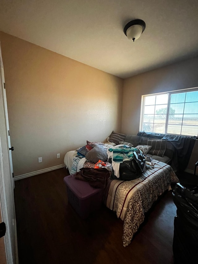 bedroom featuring dark hardwood / wood-style floors