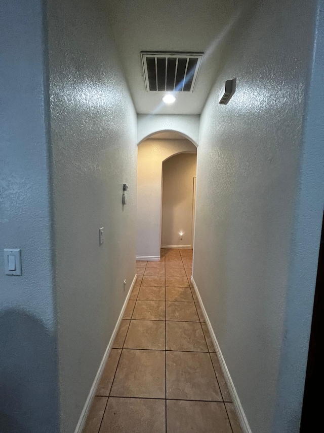 hall featuring tile patterned floors