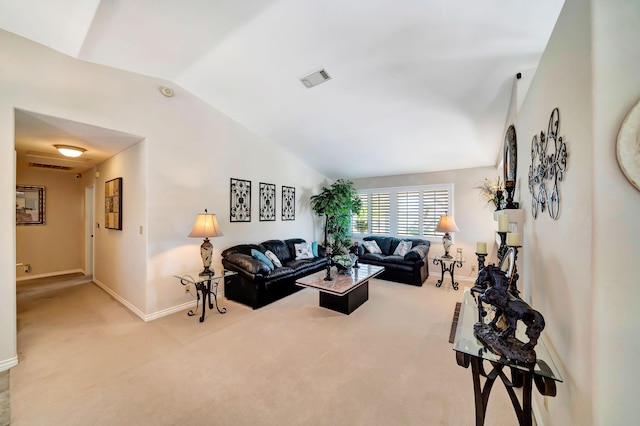 carpeted living room featuring vaulted ceiling