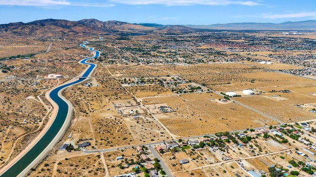 birds eye view of property featuring a mountain view