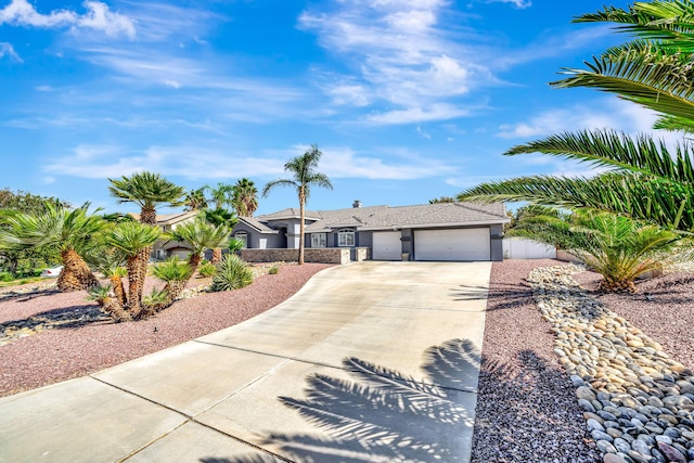 ranch-style house featuring a garage