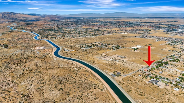 birds eye view of property featuring a mountain view