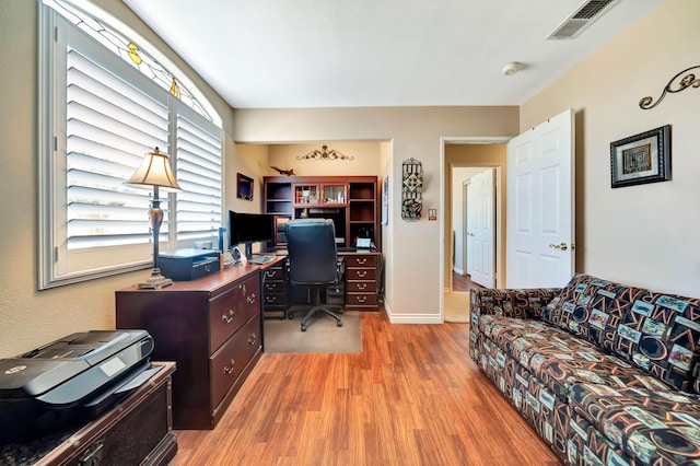 home office featuring a wealth of natural light and light wood-type flooring