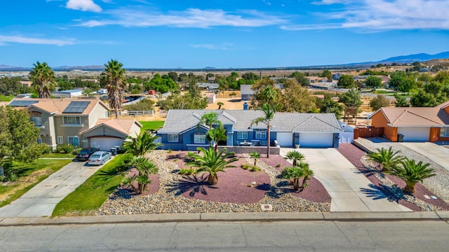 birds eye view of property featuring a mountain view