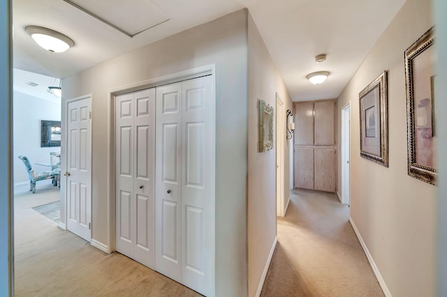 hallway with light carpet