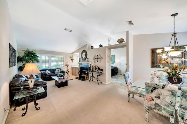 carpeted living room featuring a notable chandelier and lofted ceiling