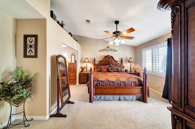 bedroom featuring ceiling fan and light carpet