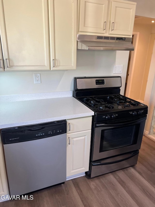 3358 Martin Ave, Mojave, CA 93501 - kitchen with dishwasher, range with gas stovetop, under cabinet range hood, dark wood-style flooring, and light countertops