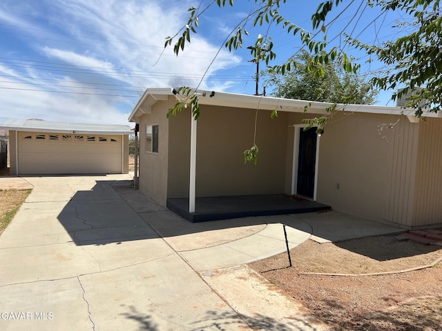 3358 Martin Ave, Mojave, CA 93501 - rear view of property with stucco siding and an outbuilding
