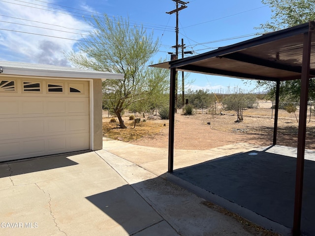 3358 Martin Ave, Mojave, CA 93501 - view of patio / terrace featuring a garage and driveway