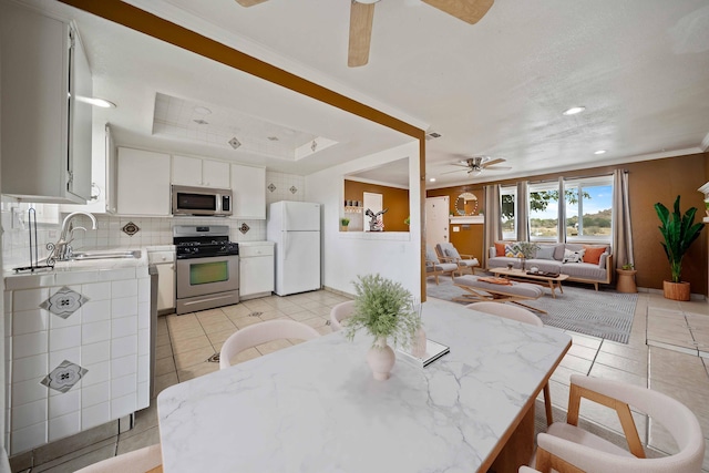 40103 E 169th St, Palmdale, CA 93591 - dining area featuring a ceiling fan, light tile patterned floors, ornamental molding, and recessed lighting