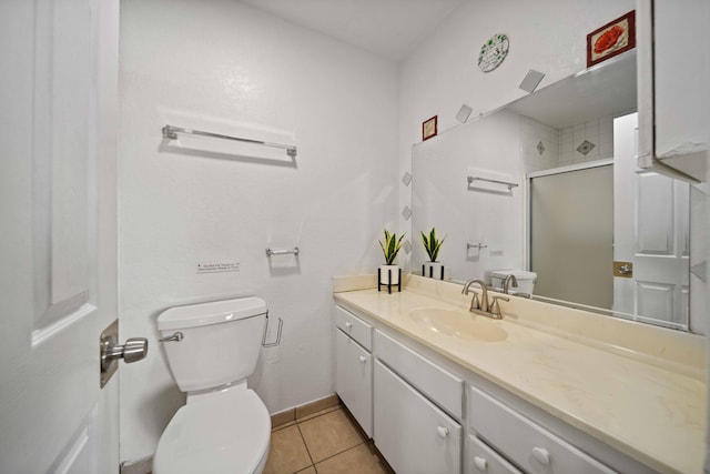 40103 E 169th St, Palmdale, CA 93591 - bathroom with toilet, vanity, a shower stall, tile patterned flooring, and baseboards