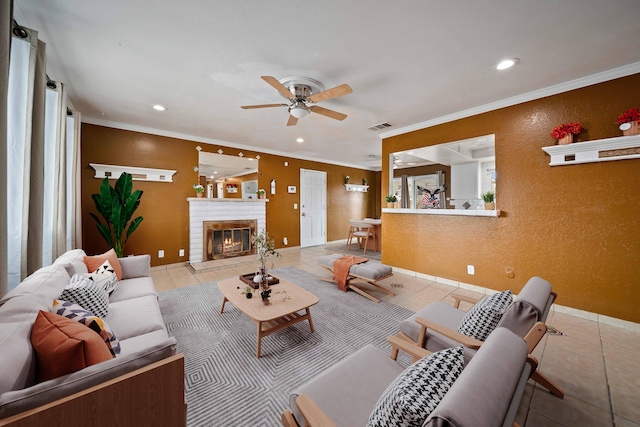 40103 E 169th St, Palmdale, CA 93591 - tiled living room featuring ceiling fan, recessed lighting, ornamental molding, a brick fireplace, and baseboards